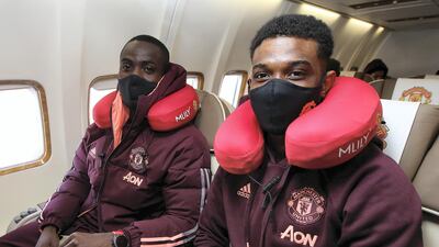 Eric Bailly of Manchester United poses on the plane ahead of their flight to Turin. Getty
