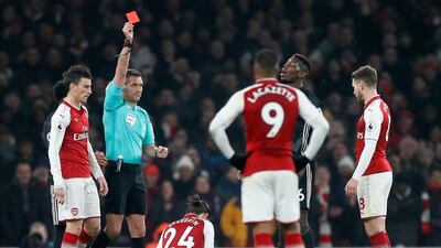Paul Pogba, second right, is given his marching orders during Manchester United's 3-1 win over Arsenal in the Premier League on Saturday. Kirsty Wigglesworth / AP Photo