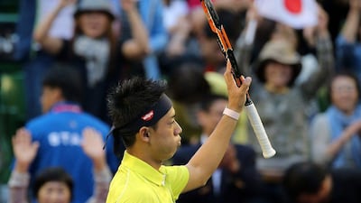 Kei Nishikori of Japan acknowledges the crowd after defeating Marin Cilic in the quarter-finals at the ATP Tokyo tournament on Friday. Eugene Hoshiko / AP / October 9, 2015