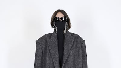 Balenciaga stretches a jumper up and over the face for spring