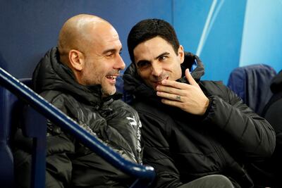 Manchester City manager Pep Guardiola with assistant coach Mikel Arteta. Reuters