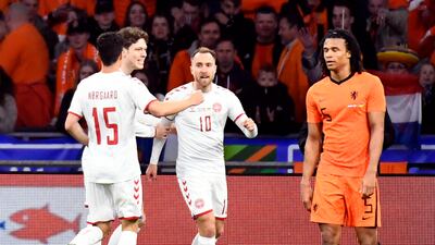 Christian Eriksen celebrates with teammates after scoring for Denmark against the Netherlands. Reuters