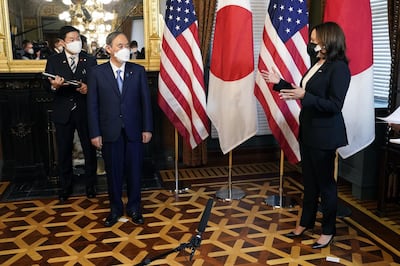 US Vice President Kamala Harris speaks with Yoshihide Suga, Japan's prime minister in Washington. Bloomberg