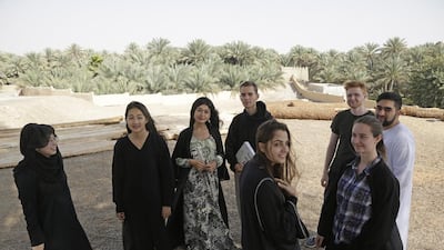From left: Afghan Abda Kazemi, Taiwanese Alice Huang, Tajik Gulnoza Mansur, Swede Alexander Burlin, Moldovan Cristina Lupusor, New Zealander Thomas Yates, Aleksandra Badowska from Poland and Firas Ashraf from the UK take a break from class. Jeffrey E Biteng / The National