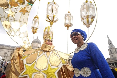 People celebrate during the Eid in the Square festival in Trafalgar Square. PA