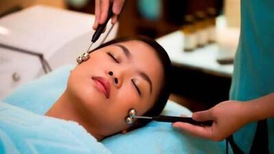 Tongs with metal balls attached are used in the treatment. Courtesy Zen the Spa