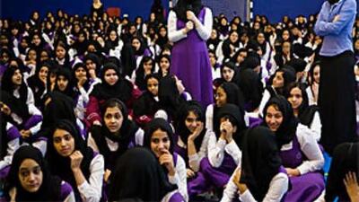 Huda Ezzeddin Mustafa, standing right, gives a presentation on diabetes prevention at Al Dana School for girls.