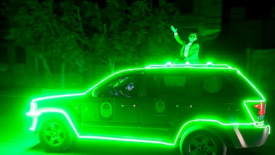 A vehicle is decorated with green lights in preparation for celebrations in Sanaa, Yemen. EPA