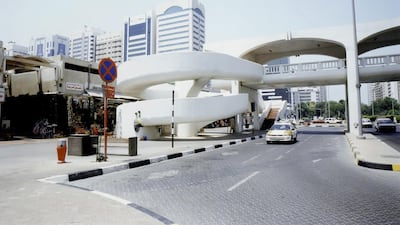 The spiral walkways to the pedestrian bridge across Khalifa bin Zayed Street in the 1990s. The Abu Dhabi souq stretched across both sides. The World Trade Centre stands on the same site today along with Burj Mohammed bin Rashid - Abu Dhabi's tallest building. Courtesy: Al Ittihad