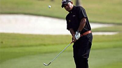 The Thai golfer Prayad Marksaeng chips on to the green during the second round of the Volvo Masters of Asia.