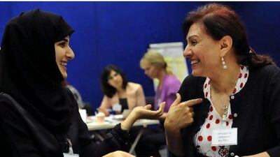 Salama al Romaithi is introduced to her 'big sister', Mahasen al Mahasneh, a career counsellor, at Zayed University. Delores Johnson / The National
