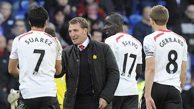 Brendan Rodgers, second from left, is confident Liverpool can win the Premier League at long last. Rebecca Naden / Reuters