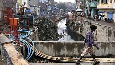As much as a quarter of India's electricity is stolen. Above, cables and exposed wires at an electricity substation in New Delhi. Kevin Frayer / AP Photo