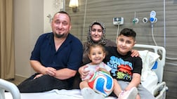 Yigit Elma, right, with his family before receiving the Elevidys treatment. Victor Besa / The National