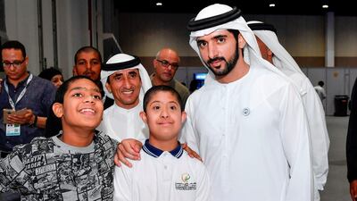 Sheikh Hamdan and Sheikh Saeed bin Maktoum bin Juma, President of the UAE Padel Association, pose for a photo at the Special Olympic Mena Games on Monday. Wam