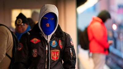 A young man waits on a subway platform in freezing temperatures in New York. AFP