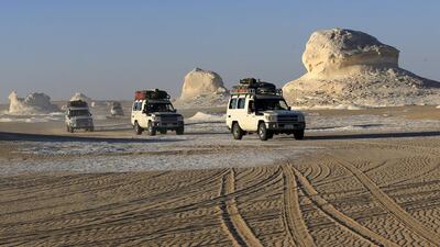 File photo of four-wheel drive cars crossing the sand dunes in the Egyptian western desert and the Bahariya Oasis, southwest of Cairo. Egyptian security forces on September 14, 2015 killed 12 tourists after mistaking the convoy for militants they were chasing in the country’s western desert, the ministry of interior said. Amr Abdallah Dalsh/Reuters