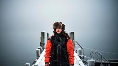 Lotta Klemming, a professional oyster diver, poses for photos after a dive at the quay near her family's company in Grebbestad in Vastra Gotaland county on Sweden's west coast. AFP