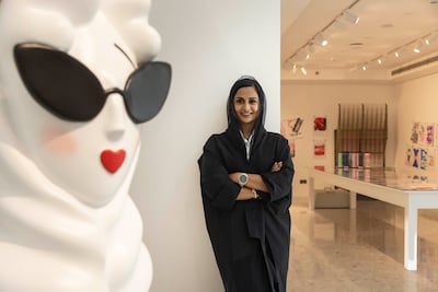 Aysha Saif Al Shamsi with Nefafa, a character she created. Antonie Robertson / The National