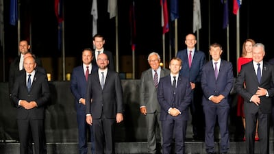 In the front row, from left, Slovenia's Prime Minister Janez Jansa, European Council President Charles Michel, French President Emmanuel Macron and Lithuania's President Gitanas Nauseda. AP