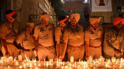 Indian Punjab Police personnel light candles as they pay tribute to those killed in the Jallianwala Bagh massacre on the eve of the 100th anniversary in Amritsar. The massacre took place on April 13, 1919, when British Indian Army soldiers on the direct orders of their officers opened fire on an unarmed gathering killing at least 379 men, women and children, according to official records. AFP