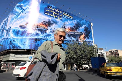 An anti-US billboard reading ‘the devil army will be drowned in the Persian Gulf’ in Enghelab Square, Tehran. AFP