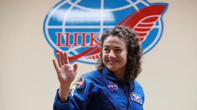 Jessica Meir waves at the final news conference. Shamil Zhumatov / Reuters