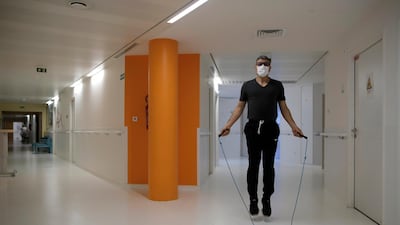 Medical worker Mohamed jumps rope as he attend a training session with French boxer Hassan N’Dam at the Villeneuve-Saint-Georges hospital, outside Paris. AP Photo