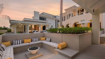 Outdoors there is a kitchen together with guest entertainment and family seating areas. Courtesy Luxhabitat Sotheby's International Realty