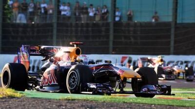 Sebastian Vettel heads Mark Webber, his Red Bull-Renault teammate, on his way to victory in yesterday’s Japanese Grand Prix. Jung Yeon-Je / AFP