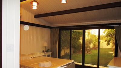 The chalet has floor to ceiling windows in the bedroom. Courtesy Ocean View Real Estate