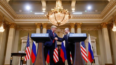 US President Donald Trump and Russian counterpart Vladimir Putin shake hands after their meeting in Helsinki, Finland. Reuters