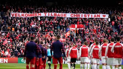 A banner reading 'Welcome back Christian', dedicated to Christian Eriksen. EPA
