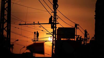Opponents of Egypt's Islamist President Mohammed Morsi stand on railway bars during a protest outside the presidential palace, in Cairo, Egypt. Hassan Ammar / AP Photo