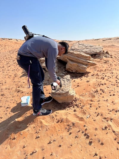 Researcher Vigneshwaran Krishnamoorthi gathers rock samples for analysis. Photo: Dr Dimitra Atri