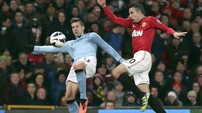 Manchester City beat eventual champions United in April but lost out on the title John Peters / Getty Images