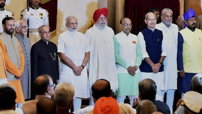 Indian President Pranab Mukherjee, third left, standing with newly sworn-in ministers at the Presidential Palace in New Delhi on July 5, 2016.