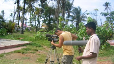 "From Dust' was directed and shot by Dhruv Dhawan while he lieved with tsunami survivors over the course of a year. Dhawan shoots a scene using a digital camera in in Sri Lanka. Courtesy Dhruv Dhawan