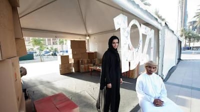 Founding members of 1971 charity group Hassa BinTamim and Almurr Al Marri at their donation collection tent at Dukkan Al Downtown in Dubai.