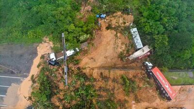 Two people were found dead in the landslide after about 30 were engulfed on a coastal highway in Parana state