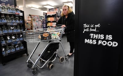 A customer at a Marks and Spencer store in London. EPA