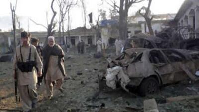 Security officials inspect the site of a suicide blast at a police station in Mingora, near the troubled Swat region.