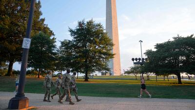 National Guard troops walk along the National Mall in Washington last week. AFP
