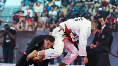 Isaque Braz, right, of Brazil, in action against the UAE's Faisal Al Ketbi on men's 85kg black belt final. Braz won the fight 2-0 to win gold. Victor Besa / The National