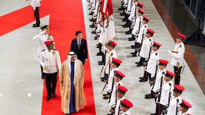 Sheikh Khaled and Mr Wong inspect the guard of honour at Parliament House