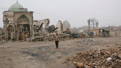 A man walks next to the destroyed Al Nuri mosque in February 2019. Reuters