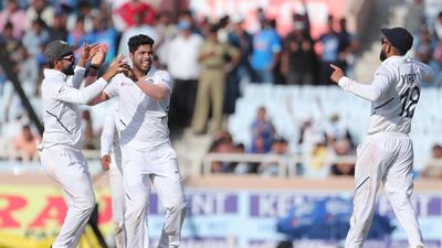 India's Umesh Yadav, second left, celebrates after taking the wicket of of South Africa batsman Heinrich Klaasen. AP