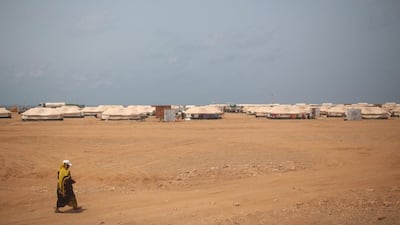 A Yemeni refugee walks on her way to the Markaze refugee camp where Yemeni refugees are stationed.