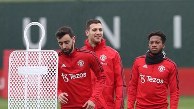 Fernandes, Diogo Dalot and Fred of Manchester United.