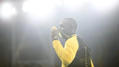Usain Bolt of Jamaica poses with his gold medal on the podium on Friday. Yoan Valat / EPA / August 19, 2016